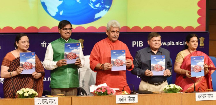 manoj sinha releasing a publication on the occasion of the world post day
